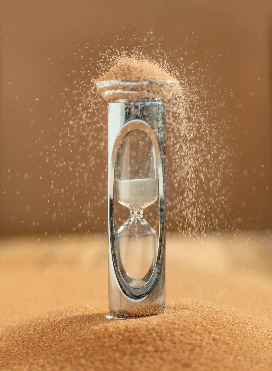 sand falling of from hourglass